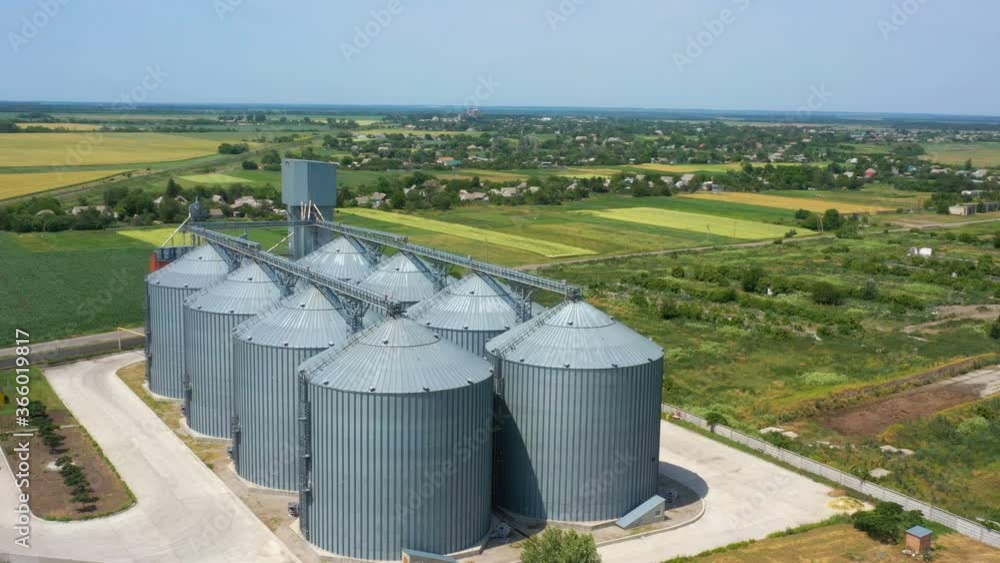 modern grain silos elevator at the field of golden wheat aerial view
modern grain silos elevator at the field of golden wheat aerial view