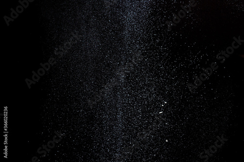 Abstract design of white powder cloud isolated on black, dark background. Abstract design of white dust cloud. Particles cloud screen saver, wallpaper.