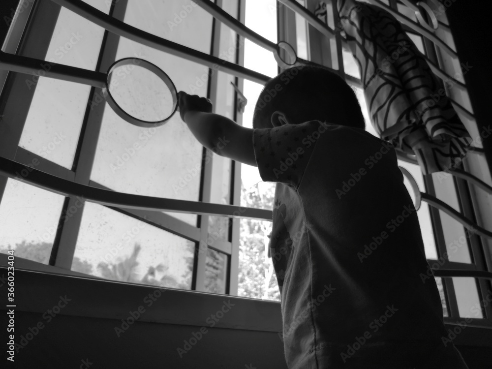 silhouette of a man or baby behind bars silhouette of a man or baby behind bars