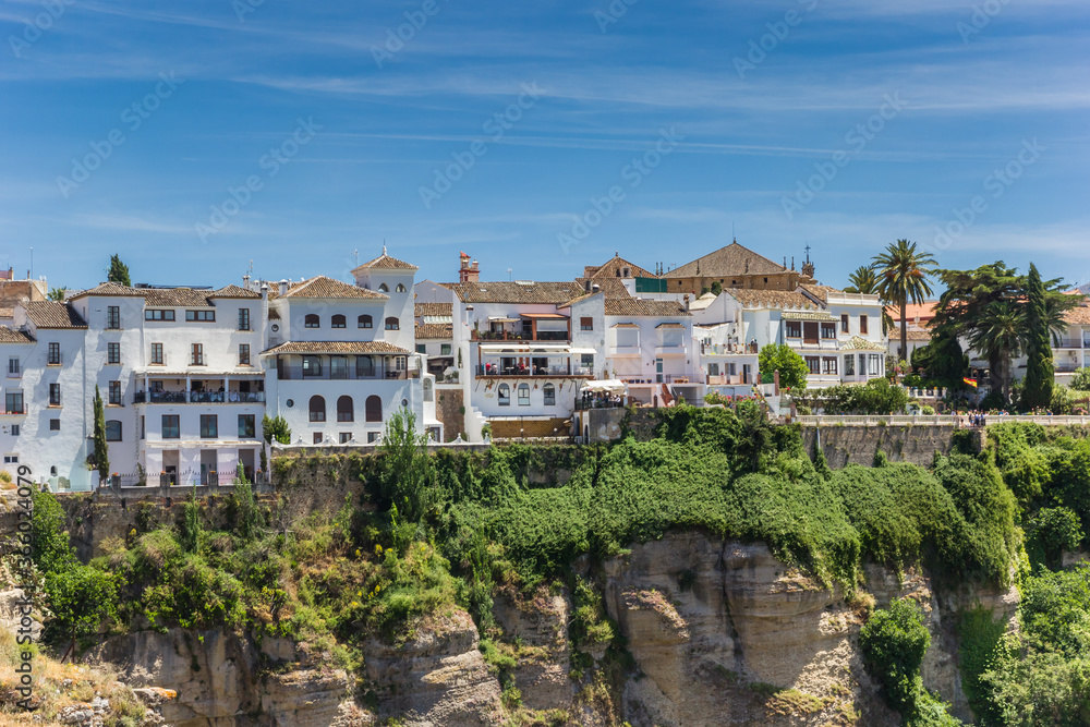 White houses at the canyon in historic city Ronda, Spain