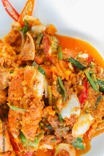 Stir Fried Crab with Curry Powder Thai food on white plate
