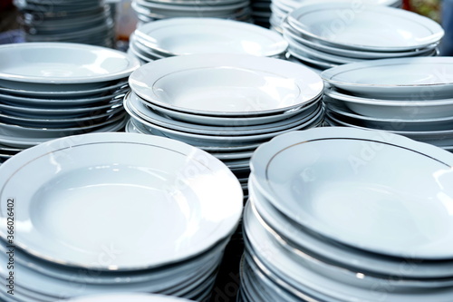 Stacked white ceramic plates on the table