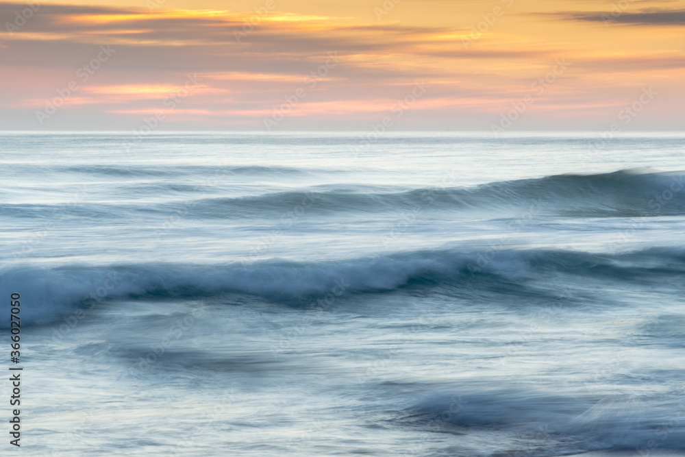 Abstract waves and orange sky during sunrise Abstract waves and orange sky during sunrise