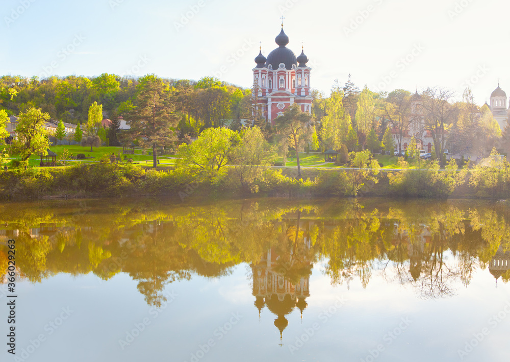 Church situated at the lake shore . Monastery Curchi from Moldova 