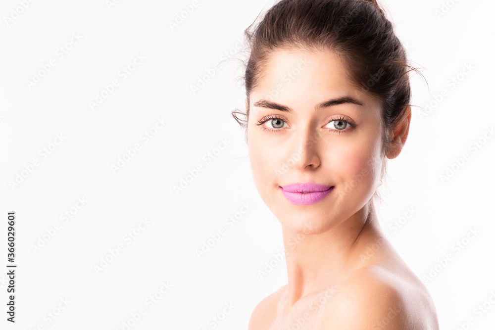 Headshot of beautiful woman wearing purple lipstic while posing at isolated white background Headshot of beautiful woman wearing purple lipstic while posing at isolated white background