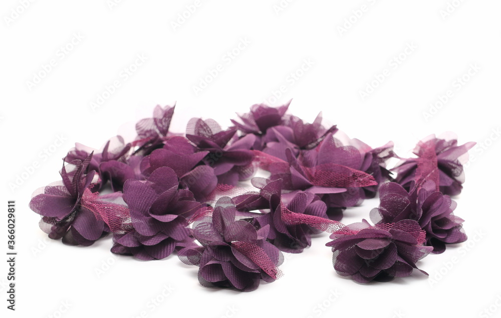 Fototapeta premium Purple fabric flowers with lace, clothing accessory isolated on white background