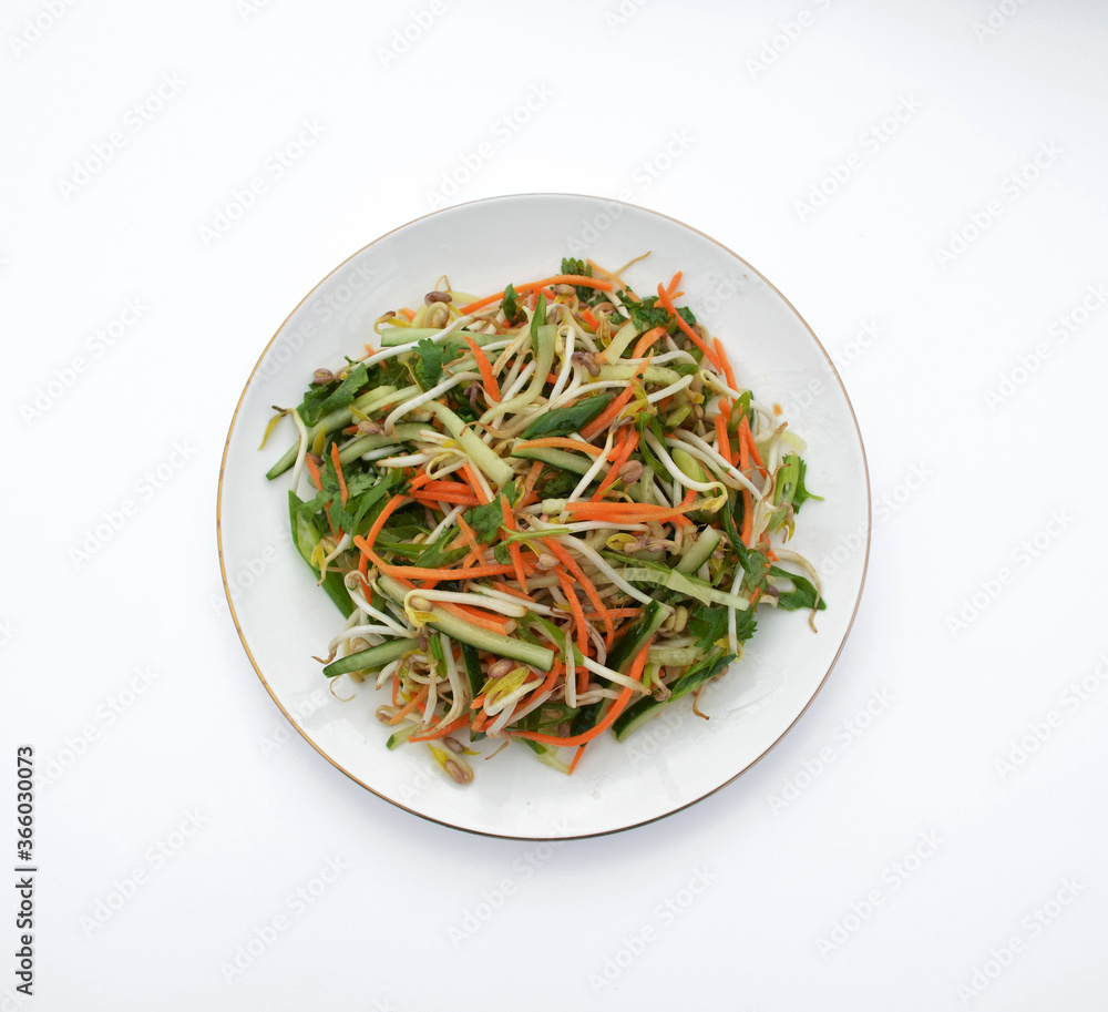 Healthy vegetable salad: carrots, cucumbers and cabbage