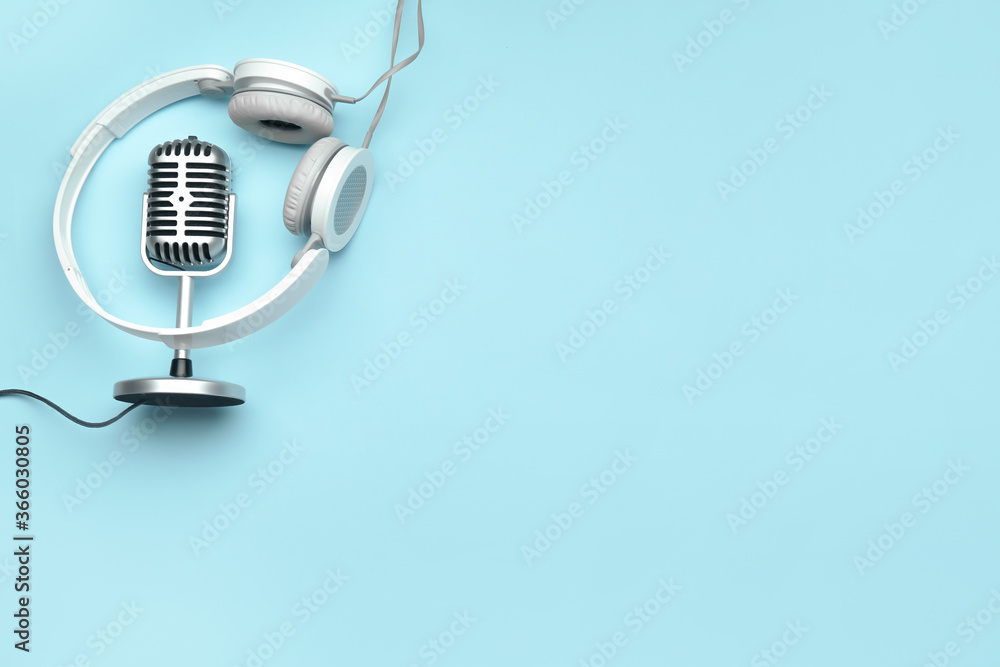 Headphones with microphone on color background - obrazy, fototapety, plakaty 