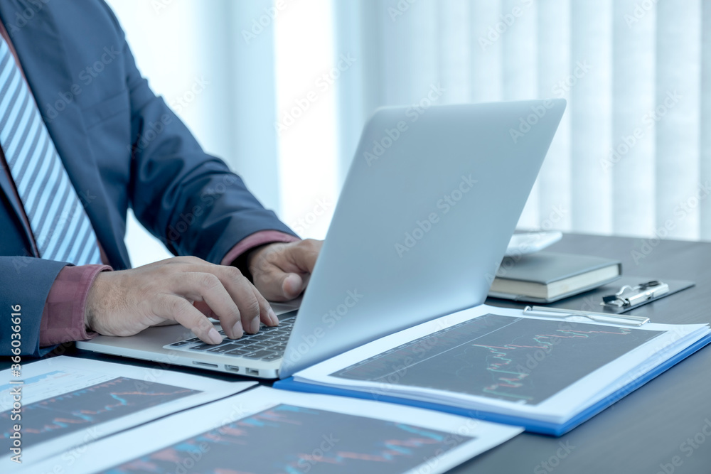 Trader businessmen analyze stock graph and report, set targets for online forex trading market management success Trader businessmen analyze stock graph and report, set targets for online forex trading market management success