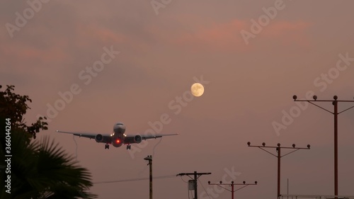 Konstfotografi Airplane landing in LAX airport at sunset, Los Angeles, California USA