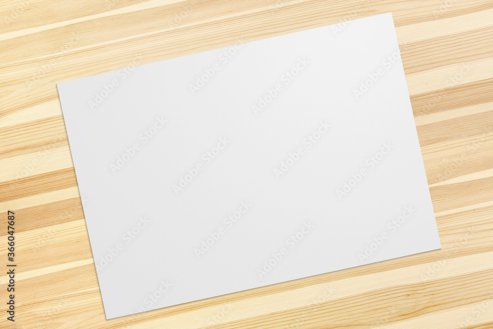Landscape blank Poster on wooden desk top view Landscape blank Poster on wooden desk top view