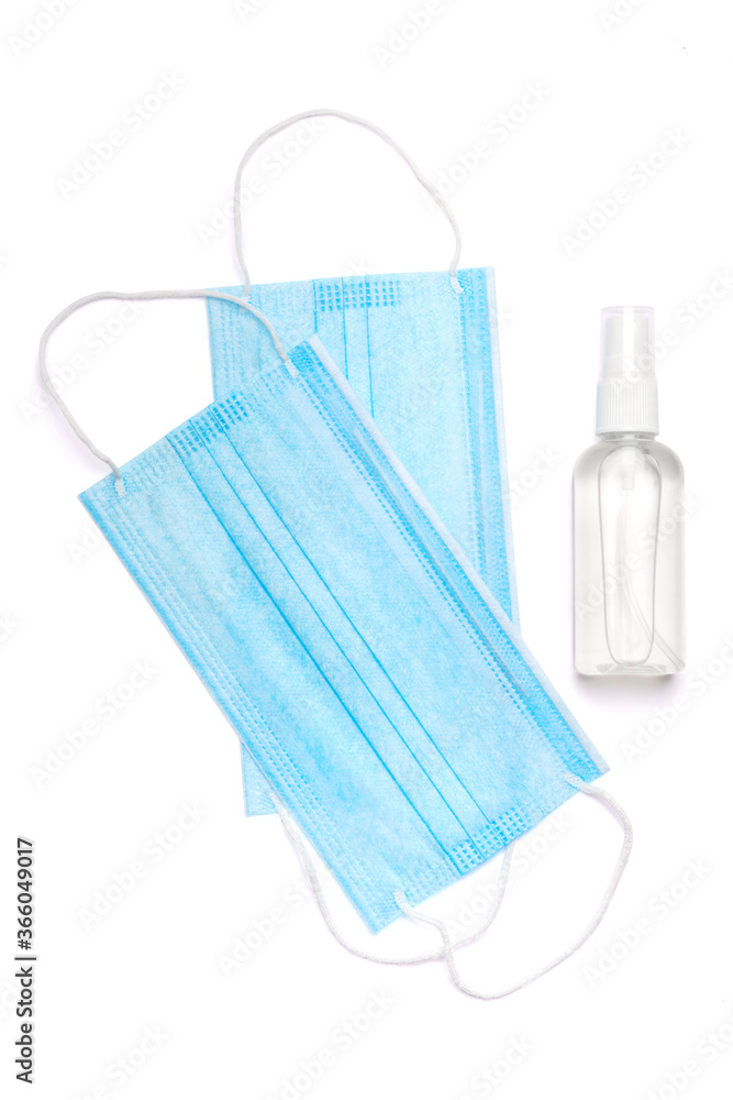 bottle of lotion, sanitizer or liquid soap and medical protective mask isolated on white background with clipping path bottle of lotion, sanitizer or liquid soap and medical protective mask isolated on white background with clipping path