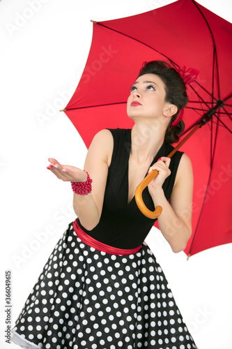 Retro girl with red umbrella look weather.