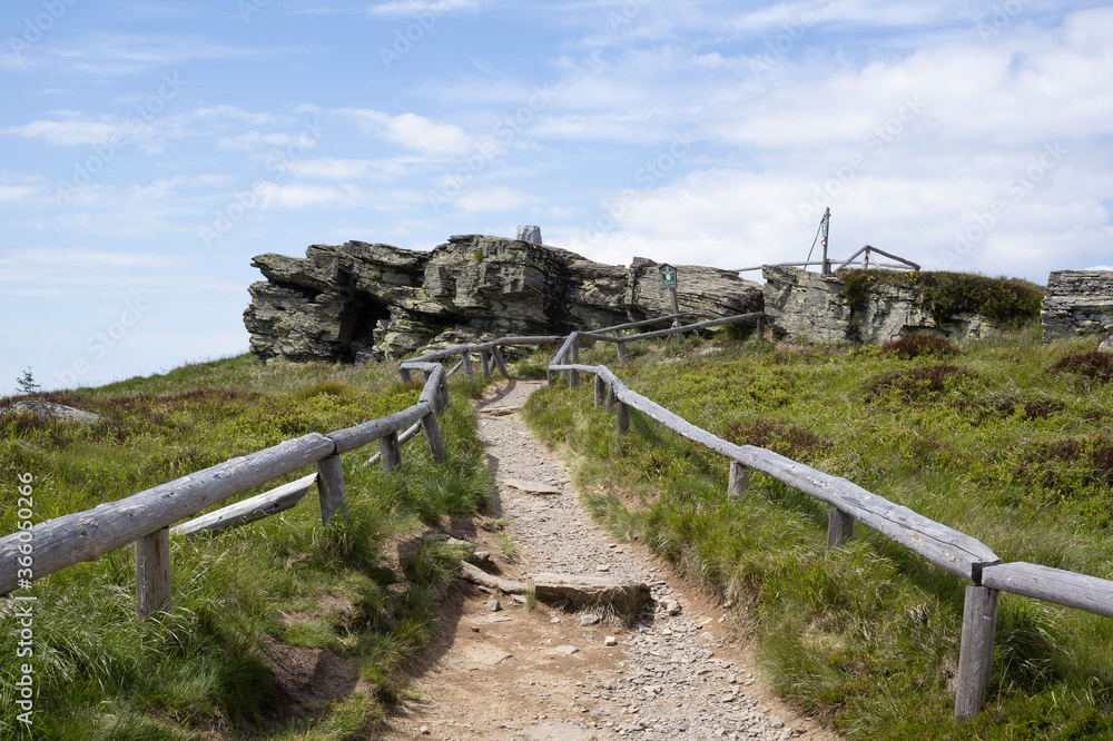 Keprnik, Jeseniky mountains, Czech Republic / Czechia - top, peak and summit of the hill. Path, footpath and pathway is leading to rock.