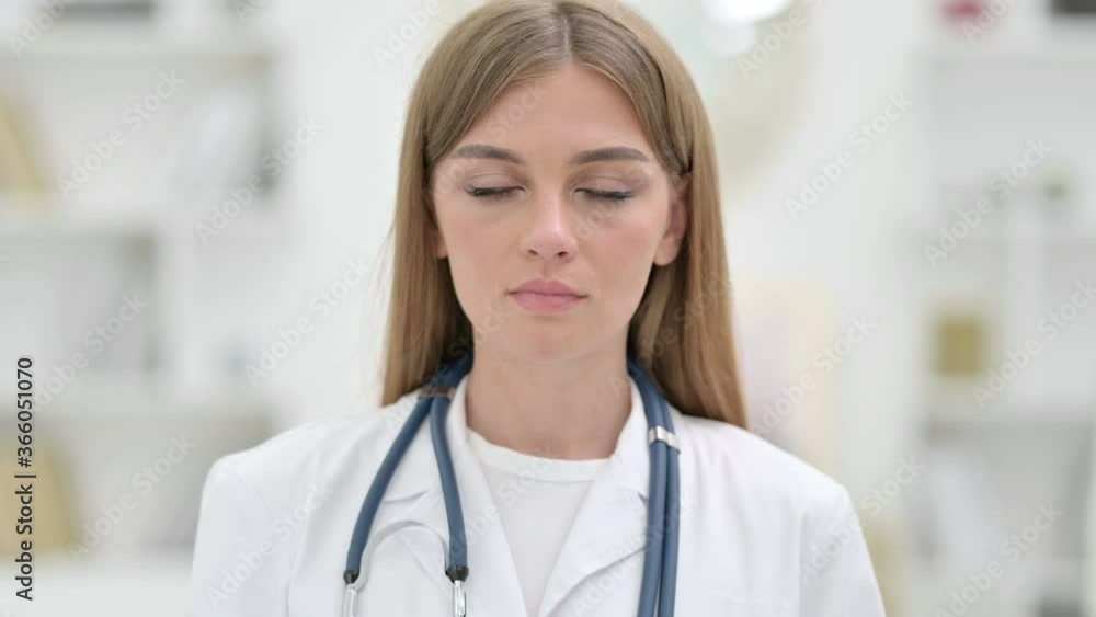 Portrait of Serious Young Doctor Looking at the Camera Portrait of Serious Young Doctor Looking at the Camera