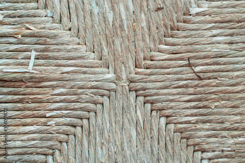 фотографія close up detail of an old and vintage raffia texture of a wooden chair with stra