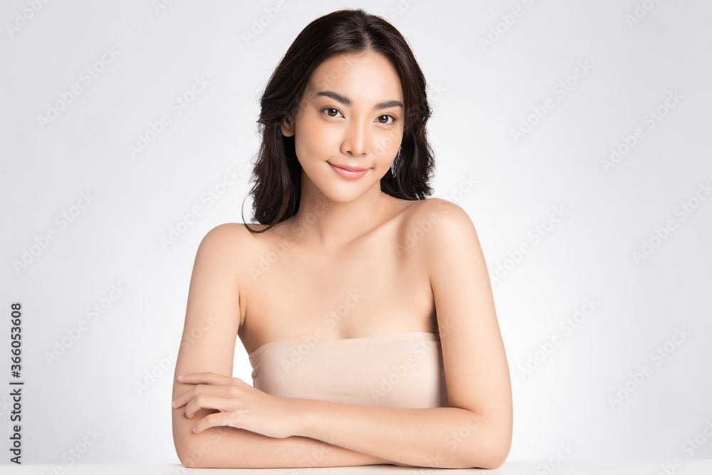 Beautiful Young asian Woman with Clean Fresh Skin, on white background, Face care, Facial treatment, Cosmetology, beauty and spa, Asian women portrait Beautiful Young asian Woman with Clean Fresh Skin, on white background, Face care, Facial treatment, Cosmetology, beauty and spa, Asian women portrait