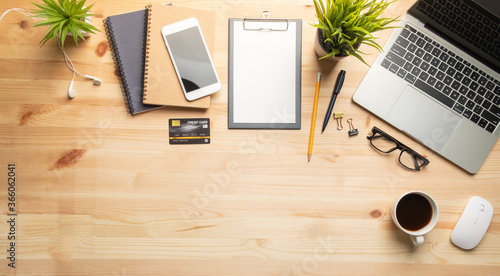 Workplace of office desk wooden table with equipment other office supplies with copy space, flat lay