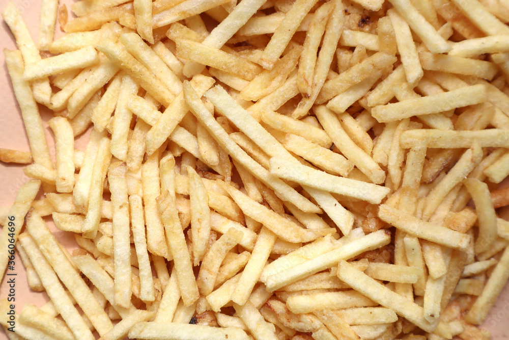 Lots of french fries on a beige background Lots of french fries on a beige background