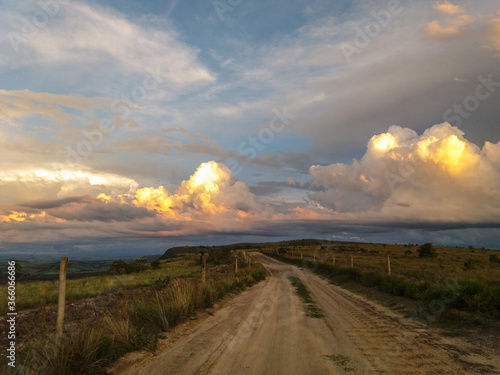 Sunset colors reflected on the cloulds at the mountains of brazilian countryside. photo