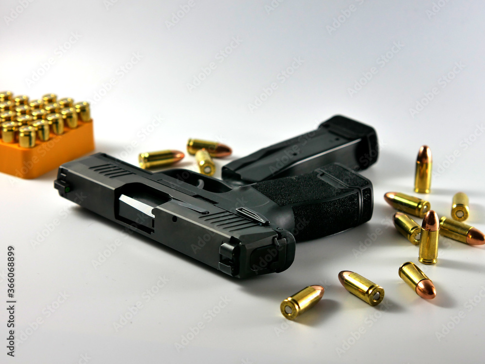 Short guns and ammunition placed on white background.Guns and ammunition are ready to use. Short guns and ammunition placed on white background.Guns and ammunition are ready to use.