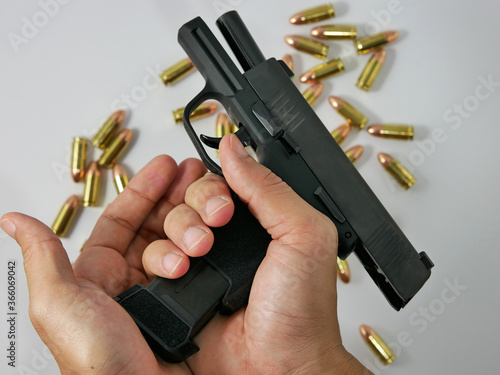 Short guns and ammunition placed on white background.Guns and ammunition are ready to use.