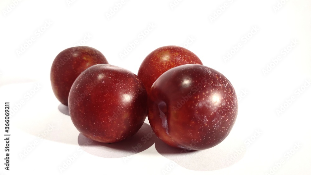 plums on white background