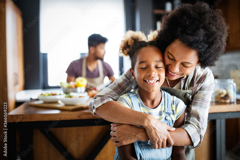 Happy family in the kitchen having fun and cooking together. Healthy food at home. Happy family in the kitchen having fun and cooking together. Healthy food at home.