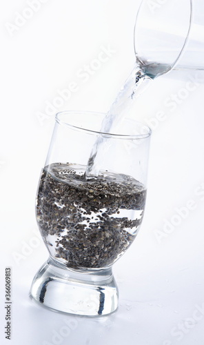 glass of water with chia seeds.