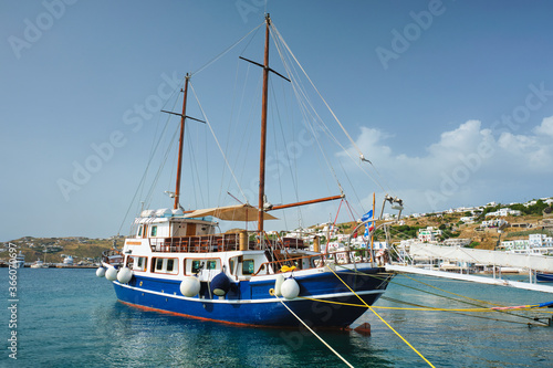 Vessel schooner moored in port harbor of Chora town, Mykonos island, Greece