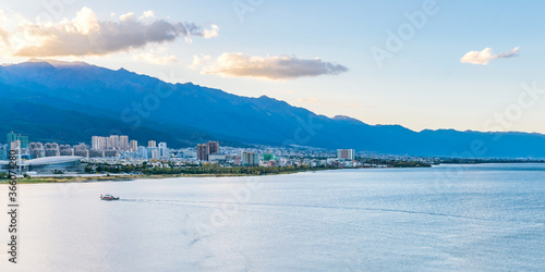 Bild auf Leinwand Yachts in Erhai Sea at dusk and in Dali City, Yunnan Province, China