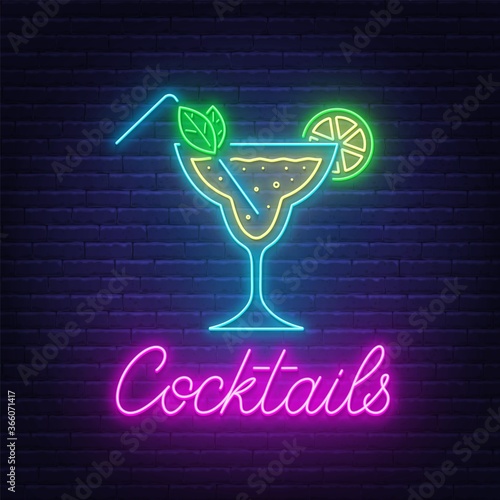 Cocktail Margarita neon sign on brick wall background .