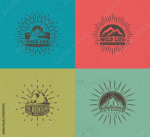 Mountain emblems. Set of four vector colored vintage badges, mountaineering camp and tourism, hiking expedition labels, vector monochrome illustration collection