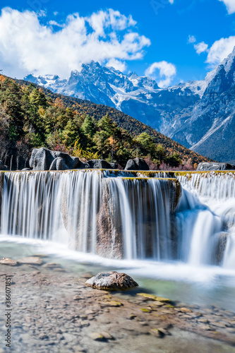 Scenery of Blue Moon Valley Waterfall in Yulong Snow Mountain  Lijiang  Yunnan  China