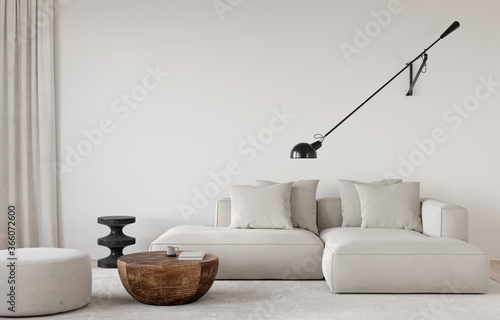 Stylish living room in beige tones with a sofa, a sconce, a wooden table, a marble side table and pouf