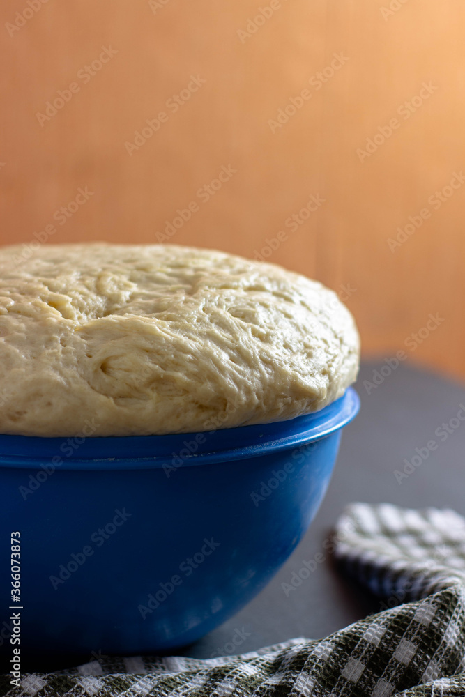 yeast dough for pie in a bowl on the table yeast dough for pie in a bowl on the table
