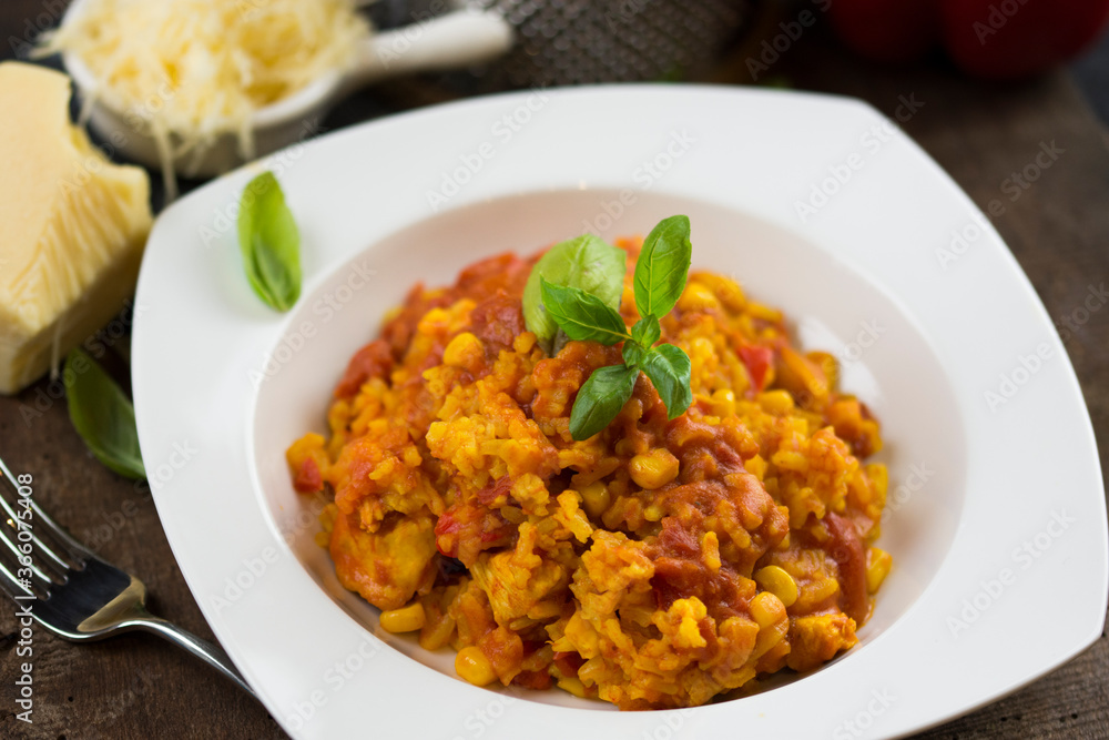 Rice and chicken breast cooked in tomato sauce. Rice and chicken breast cooked in tomato sauce.