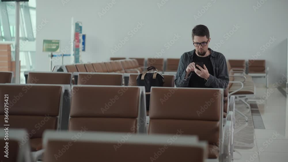 traveler in terminal of airport, waiting, connecting wifi traveler in terminal of airport, waiting, connecting wifi
