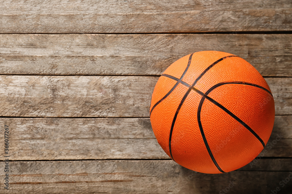 Ball for playing basketball game on wooden background