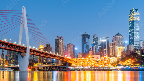 Low-angle night view of Hongya Cave and Jialing River in Chongqing, China photo