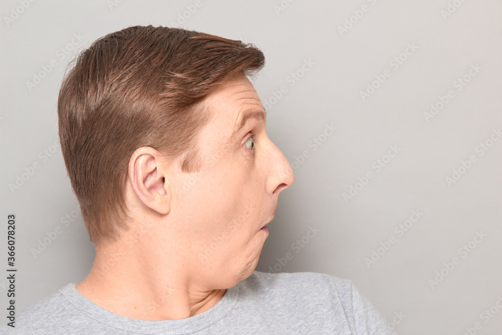 Portrait of funny surprised man, looking at something extraordinary Portrait of funny surprised man, looking at something extraordinary