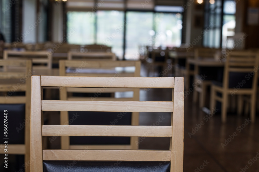 Wood table top on blur empty restaurant interior background. Wood table top on blur empty restaurant interior background.