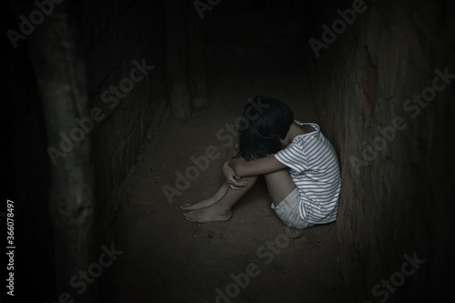 Принти на полотні Kidnapped little girl sitting in old dark room