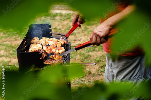 A man preparing barbecue at home