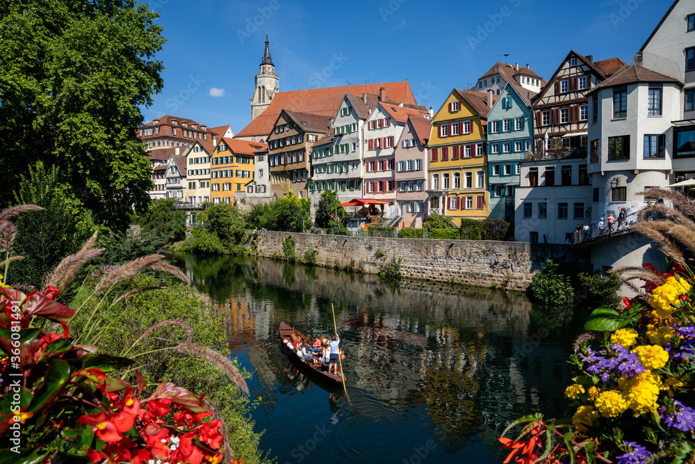 view of old town Tuebingen on the Neckar River with a Stocherkahn boat in the foreground