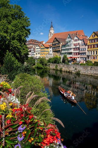 view of old town Tuebingen on the Neckar River with a Stocherkahn boat in the foreground photo