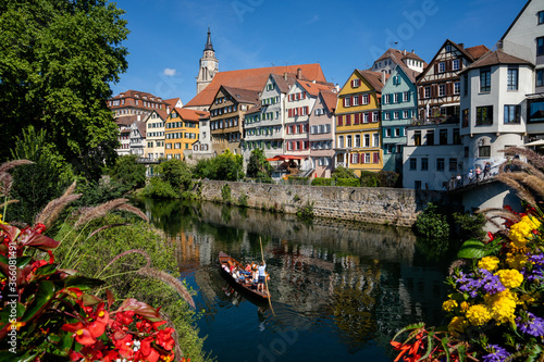 view of old town Tuebingen on the Neckar River with a Stocherkahn boat in the foreground