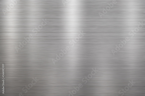 Silver metal texture of brushed stainless steel plate with the reflection of light.