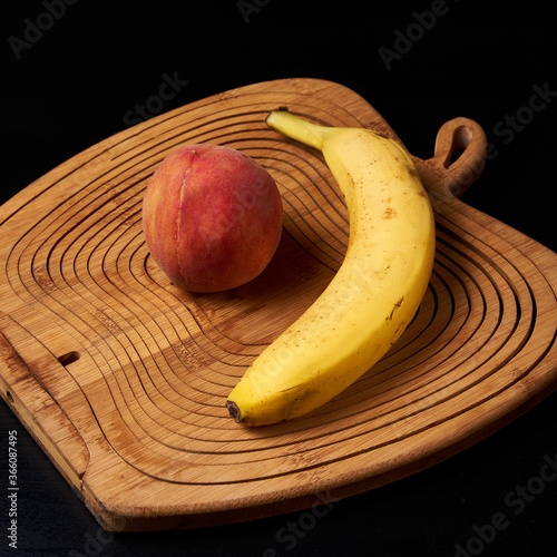 bananas, peaches are on the table