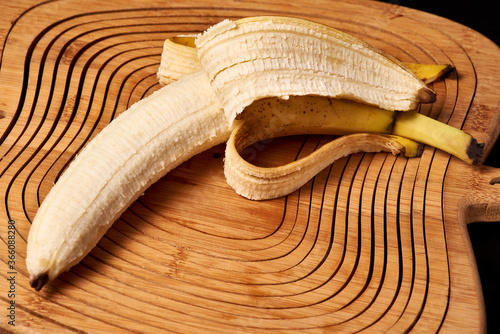 A peeled banana lies on the table